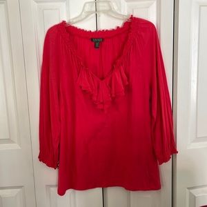 Women’s bright orange long sleeve blouse. Ruffled at v-neck